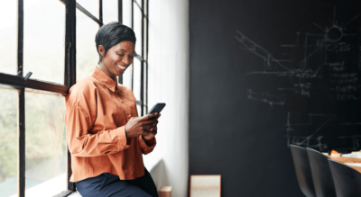 Woman interacting with her smart phone